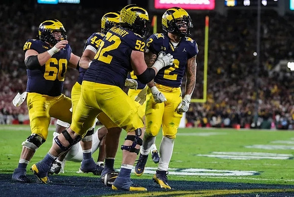 Drake Nugent (60), Max Bredeson (44), Karsen Barnhart (52), and Blake Corum (2)