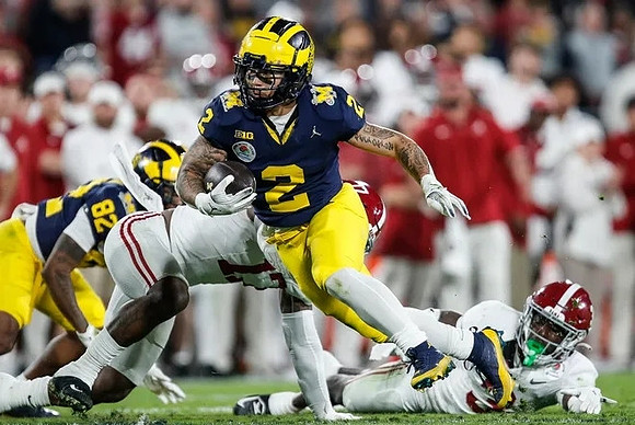 Semaj Morgan (82) and Blake Corum (2)