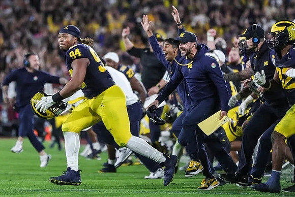 Kris Jenkins (94), Jesse Minter, and Jim Harbaugh