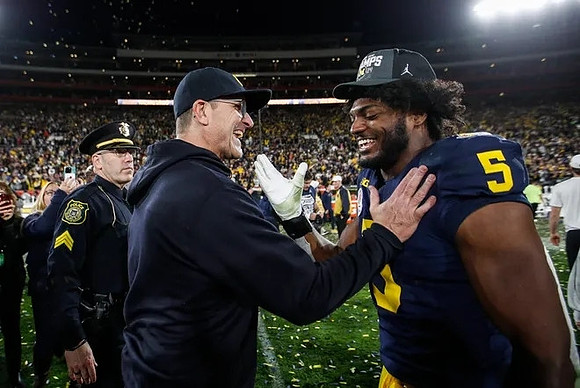 Jim Harbaugh and Josaiah Stewart (5)