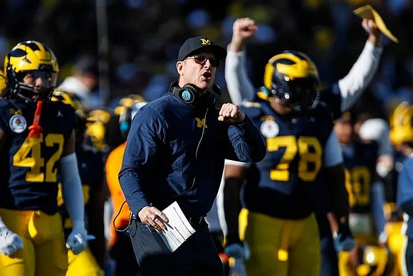TJ Guy (42), Jim Harbaugh, and Kenneth Grant (78)