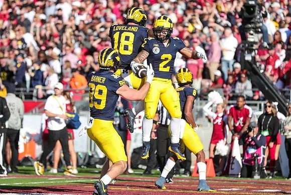 AJ Barner (89), Colston Loveland (18), Blake Corum (2), and Cornelius Johnson (6)
