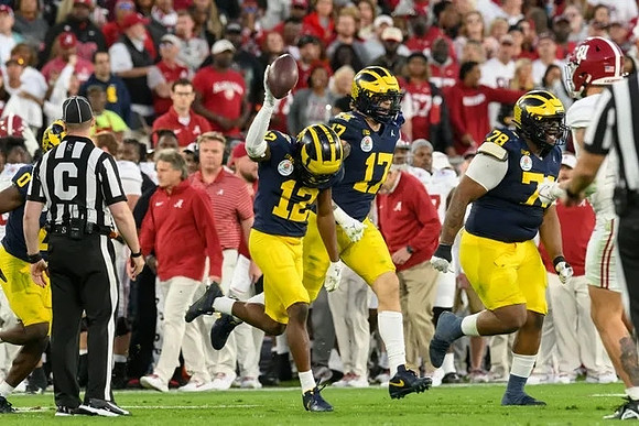 Mike Sainristil (0), Josh Wallace (12), Braiden McGregor (17), and Kenneth Grant (78)