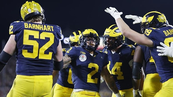 Karsen Barnhart (52), Blake Corum (2), Max Bredeson (44), and AJ Barner (89)