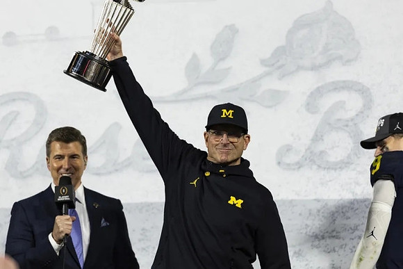 Jim Harbaugh, J.J. McCarthy (9), and Rose Bowl Trophy