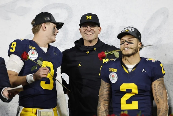 J.J. McCarthy (9), Jim Harbaugh, and Blake Corum (2)