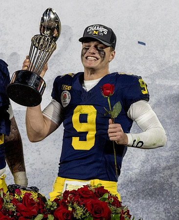 J.J. McCarthy (9) and Rose Bowl Trophy