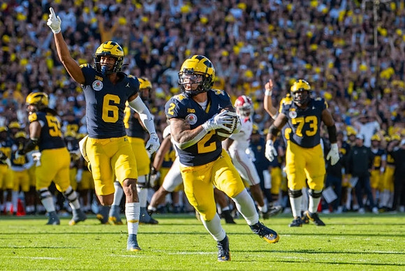 Trente Jones (53), Cornelius Johnson (6), Blake Corum (2), and LaDarius Henderson (73)