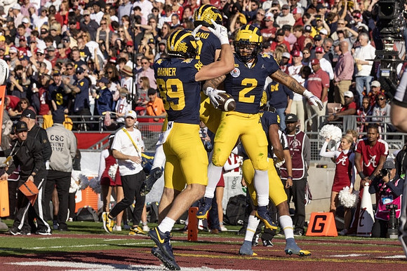 AJ Barner (89), Colston Loveland (18), and Blake Corum (2)