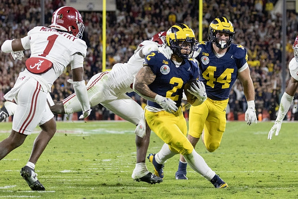 Blake Corum (2) and Max Bredeson (44)