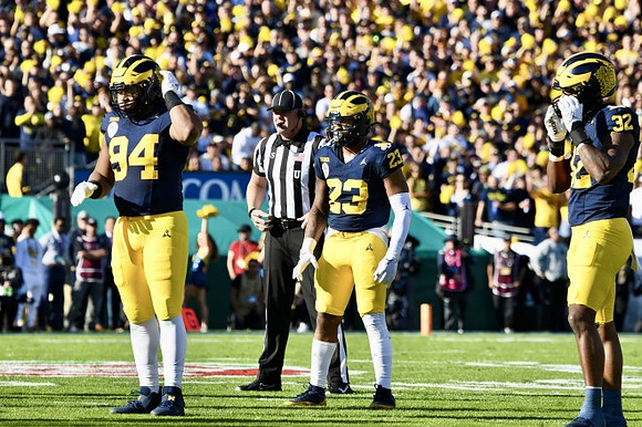 Kris Jenkins (94), Michael Barrett (23), and Jaylen Harrell (32)