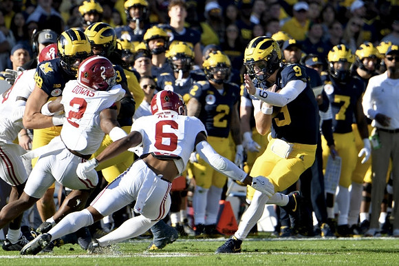 AJ Barner (89) and J.J. McCarthy (9)