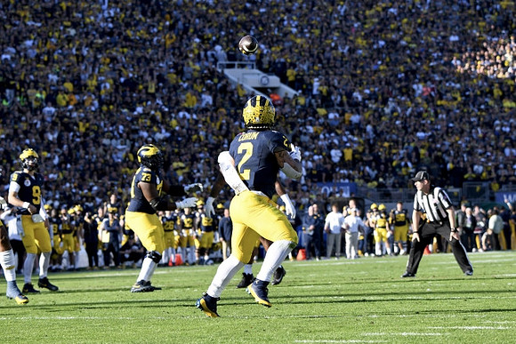 J.J. McCarthy (9), LaDarius Henderson (73), and Blake Corum (2)