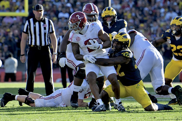 Jaylen Harrell (32), Mason Graham (55), and Michael Barrett (23)
