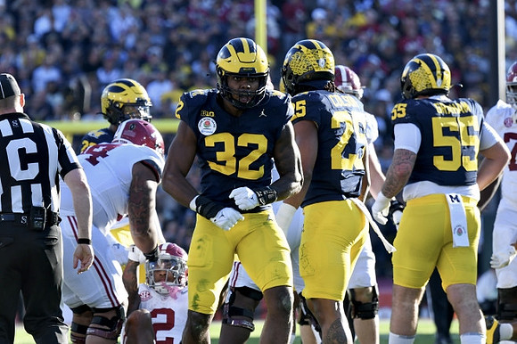 Jaylen Harrell (32), Junior Colson (25), and Mason Graham (55)