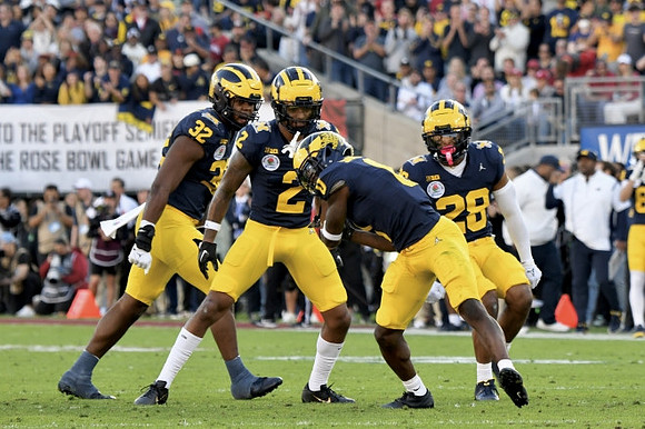 Jaylen Harrell (32), Will Johnson (2), Mike Sainristil (0), and Quinten Johnson (28)