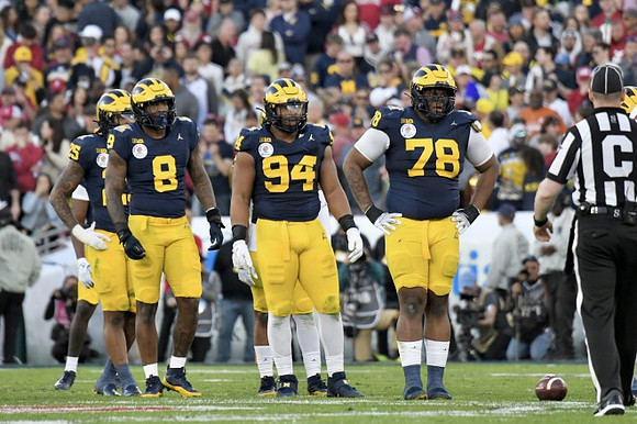 Junior Colson (25), Derrick Moore (8), Kris Jenkins (94), and Kenneth Grant (78)