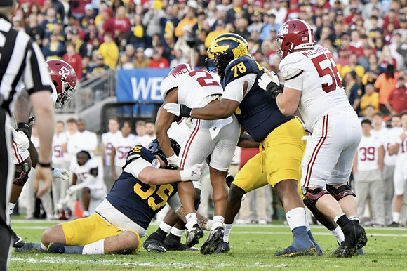 Mason Graham (55) and Kenneth Grant (78)