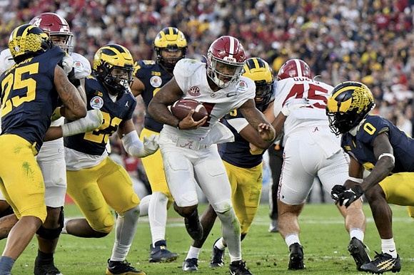 Junior Colson (25), Michael Barrett (23), Kris Jenkins (94), and Mike Sainristil (0)
