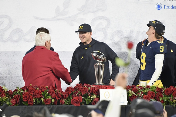 Jim Harbaugh, J.J. McCarthy (9), and Rose Bowl Trophy