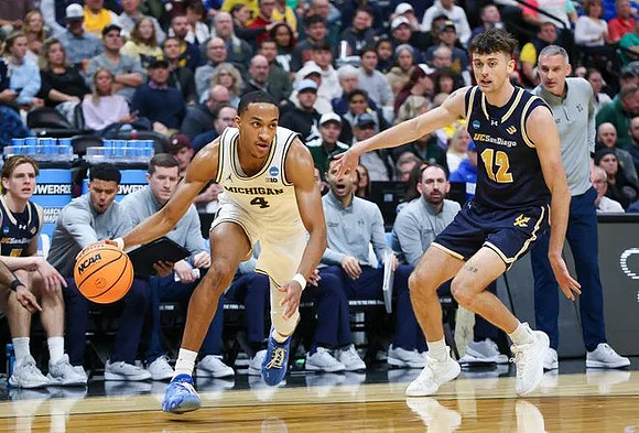 Nimari Burnett (4) and UC San Diego Head Coach Eric Olen