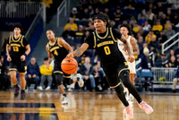 Olivier Nkamhoua (13), Nimari Burnett (4), and Dug McDaniel (0)