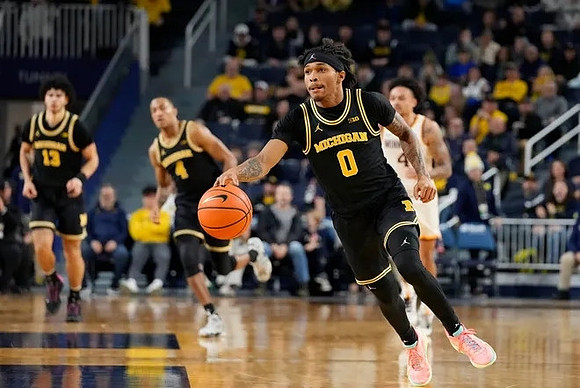 Olivier Nkamhoua (13), Nimari Burnett (4), and Dug McDaniel (0)