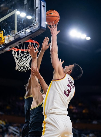 Tarris Reed Jr. (32) and Will Tschetter (42)
