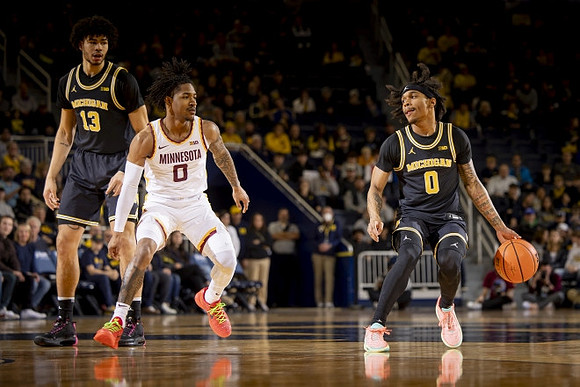 Olivier Nkamhoua (13) and Dug McDaniel (0)