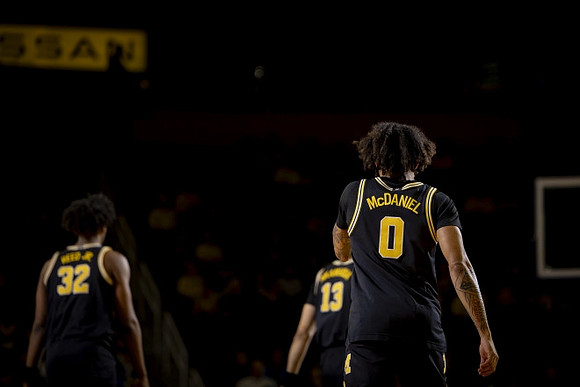 Tarris Reed Jr. (32), Olivier Nkamhoua (13), and Dug McDaniel (0)
