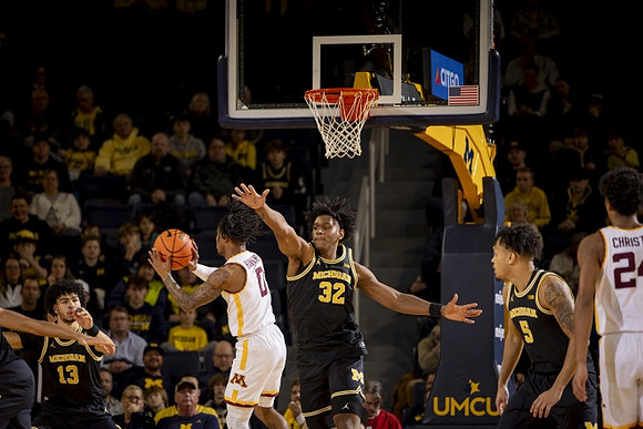 Olivier Nkamhoua (13), Tarris Reed Jr. (32), and Terrance Williams II (5)