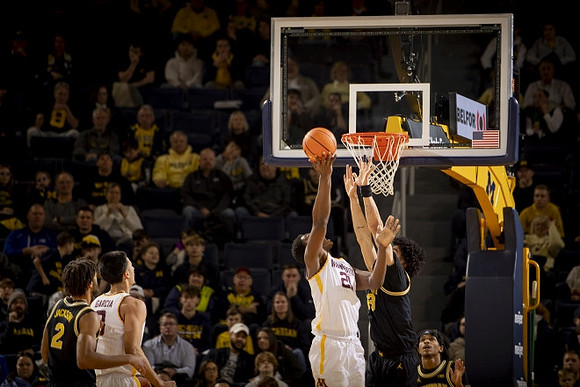 Tray Jackson (2), Olivier Nkamhoua (13), and Dug McDaniel (0)