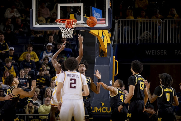 Tarris Reed Jr. (32), Nimari Burnett (4), Olivier Nkamhoua (13), and Dug McDaniel (0)