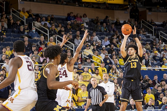 Tarris Reed Jr. (32) and Olivier Nkamhoua (13)
