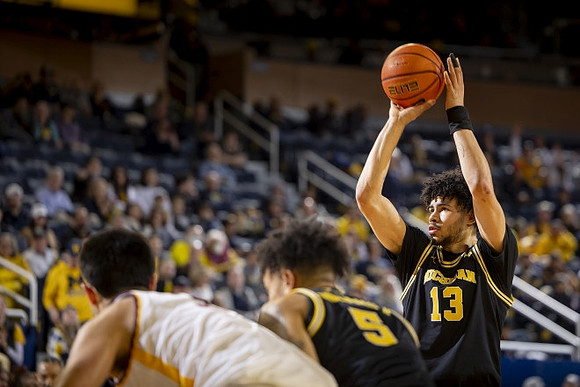 Terrance Williams II (5) and Olivier Nkamhoua (13)