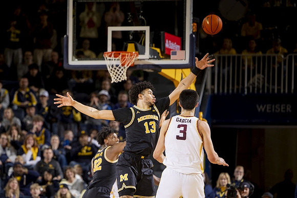 Tarris Reed Jr. (32) and Olivier Nkamhoua (13)