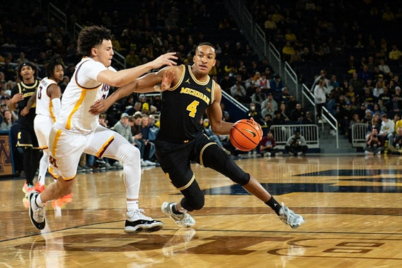 Dug McDaniel (0) and Nimari Burnett (4)