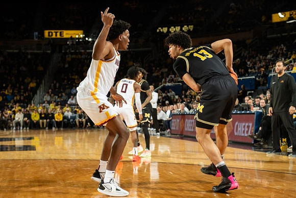 Olivier Nkamhoua (13) and Dug McDaniel (0)