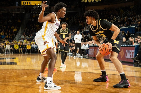 Dug McDaniel (0) and Olivier Nkamhoua (13)