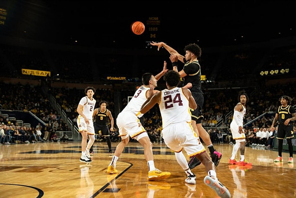 Terrance Williams II (5), Olivier Nkamhoua (13), and Dug McDaniel (0)