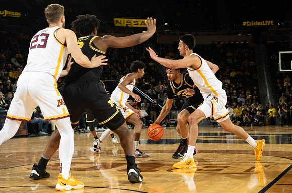 Tarris Reed Jr. (32) and Olivier Nkamhoua (13)