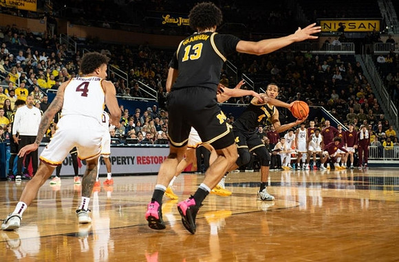 Olivier Nkamhoua (13) and Nimari Burnett (4)