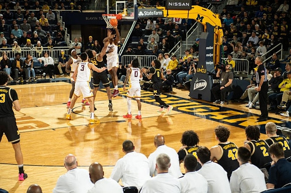 Olivier Nkamhoua (13), Tarris Reed Jr. (32), and Dug McDaniel (0)
