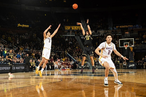 Dug McDaniel (0) and Olivier Nkamhoua (13)
