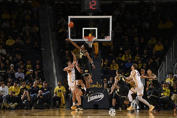 Tarris Reed Jr. (32) and Nimari Burnett (4)