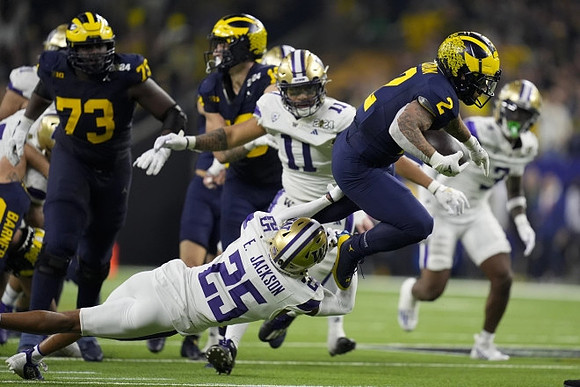 LaDarius Henderson (73), Colston Loveland (18), and Blake Corum (2)