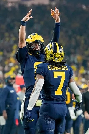 J.J. McCarthy (9) and Donovan Edwards (7)