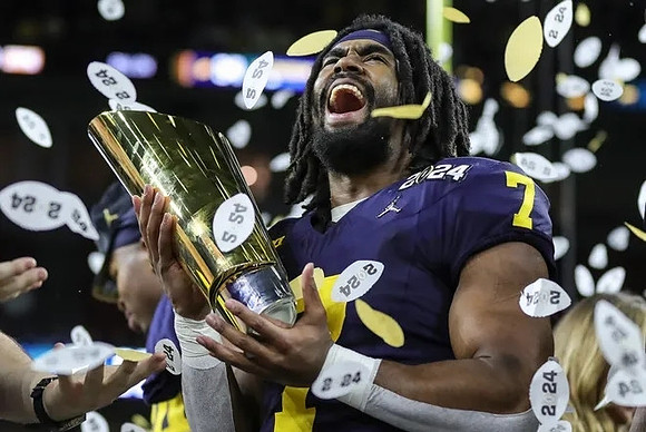 Donovan Edwards (7) and National Championship Trophy