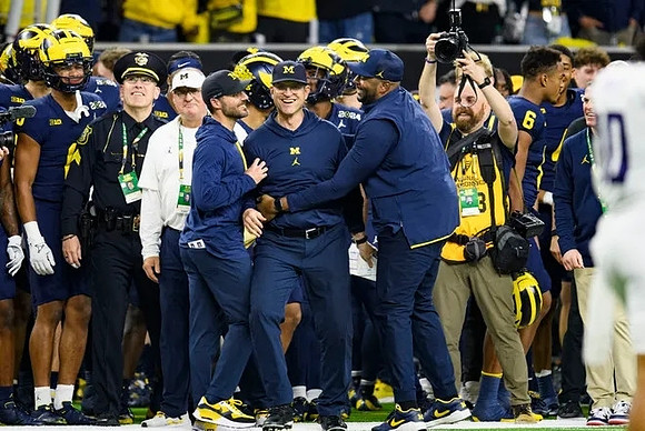 Jesse Minter, Jim Harbaugh, and Sherrone Moore