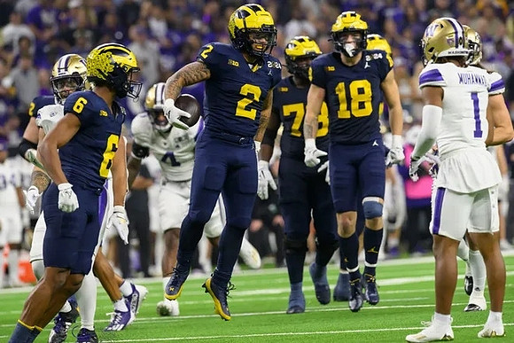 Cornelius Johnson (6), Blake Corum (2), Myles Hinton (78), and Colston Loveland (18)